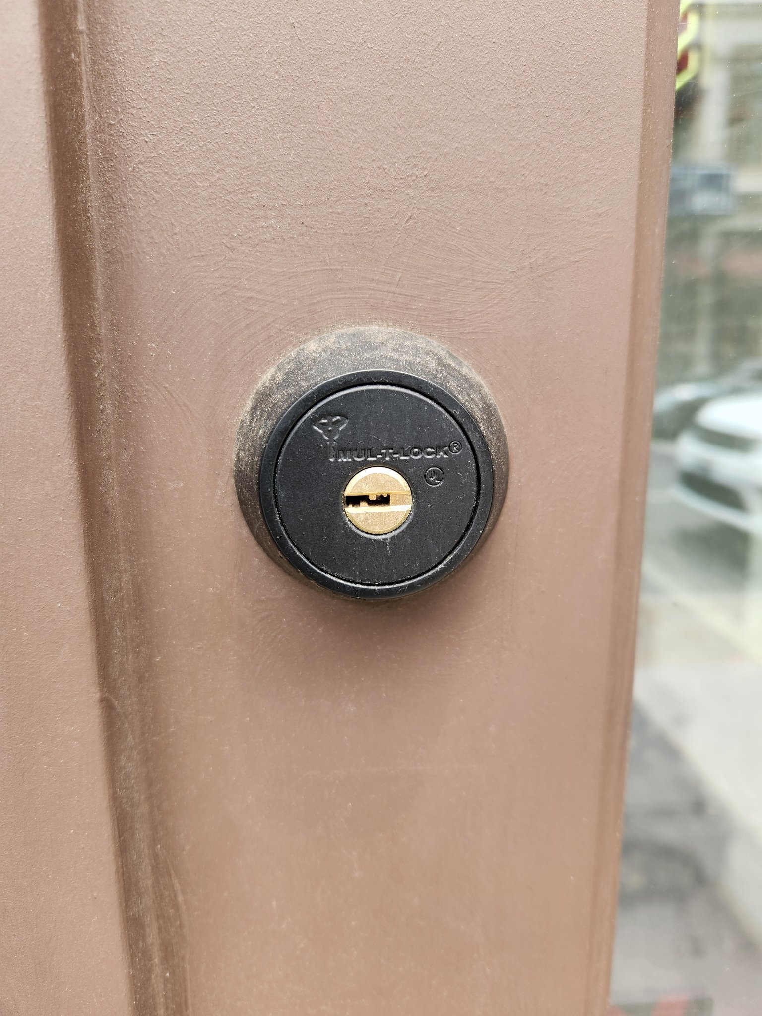 Mul-T-Lock deadbolt cylinder on a commercial metal door
