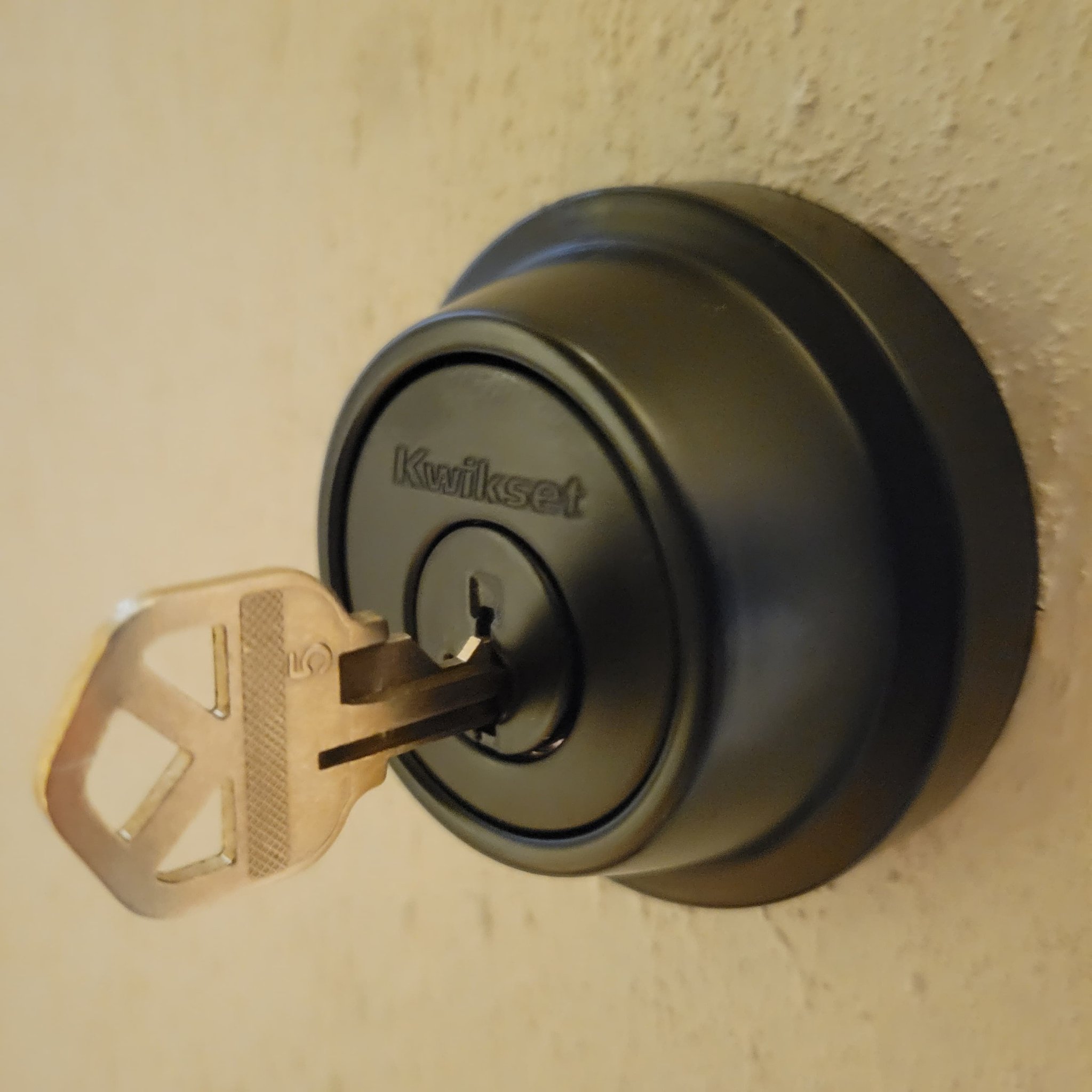 Kwikset matte black deadbolt with key